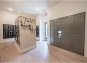 Thumbnail 25 of 74 - A library with a wooden floor and a wall of books at Waterleaf at Neely Ferry Apartments, Simpsonville, 29680