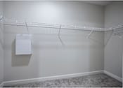 Thumbnail 35 of 74 - A white closet with a coat hanging on the rack at Waterleaf at Neely Ferry Apartments, Simpsonville, South Carolina