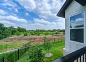 Thumbnail 6 of 50 - the view of the yard from the balcony of a home at Legacy at Cibolo, Boerne, TX, 78006