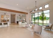 Thumbnail 15 of 50 - the living room has large windows and a chandelier at Legacy at Cibolo, Boerne, 78006