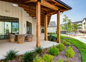 Thumbnail 19 of 50 - a covered patio with a table and chairs at Legacy at Cibolo, Boerne