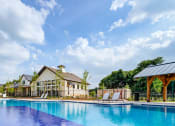 Thumbnail 40 of 50 - a large swimming pool in front of a group of houses at Legacy at Cibolo, Boerne