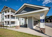 Thumbnail 52 of 74 - The image shows a building with a sign that reads at Waterleaf at Neely Ferry Apartments, Simpsonville, SC 29680
