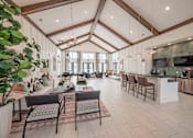 Thumbnail 61 of 74 - A spacious living room with a kitchen area in the background at Waterleaf at Neely Ferry Apartments, Simpsonville, 29680