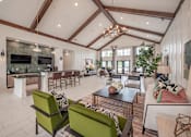 Thumbnail 62 of 74 - A modern living room with a stone fireplace and a large open space at Waterleaf at Neely Ferry Apartments, Simpsonville, South Carolina