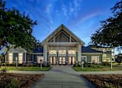Thumbnail 41 of 74 - A modern building with a large entrance and glass windows at Waterleaf at Neely Ferry Apartments, Simpsonville, South Carolina
