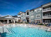 Thumbnail 38 of 74 - A large swimming pool in front of apartment at Waterleaf at Neely Ferry Apartments, South Carolina 29680