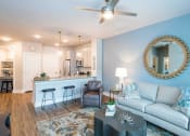 Thumbnail 6 of 32 - a living room with a couch and a table at Bellary Flats Apartments, Summerville , SC