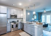 Thumbnail 28 of 32 - a kitchen with stainless steel appliances at Bellary Flats Apartments, South Carolina
