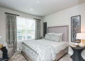 Thumbnail 14 of 32 - a bedroom with a bed and a window at Bellary Flats Apartments, Summerville , 29486