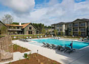 Thumbnail 10 of 32 - our apartments have a large pool and lounge chairs at Bellary Flats Apartments, Summerville , SC 29486