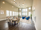 Thumbnail 11 of 20 - A dining room with a table set for six.