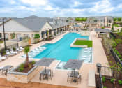 Thumbnail 22 of 39 - an aerial view of a swimming pool with tables and umbrellas at Citadel at Westpointe, Texas