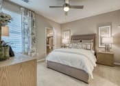 Thumbnail 19 of 39 - a bedroom with a bed and a ceiling fan at Citadel at Westpointe, San Antonio, Texas