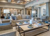 Thumbnail 38 of 39 - a living room with couches and tables and a chandelier at Citadel at Westpointe, San Antonio, Texas