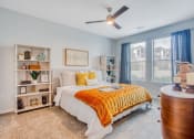 Thumbnail 5 of 15 - a bedroom with a bed and a ceiling fan  at Edge and Stone, San Antonio, 78260