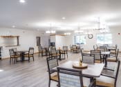Thumbnail 1 of 35 - the dining room at our community center with tables and chairs