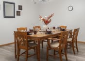 Thumbnail 4 of 35 - a dining room with a table and chairs and a chandelier