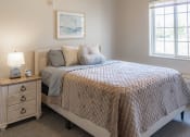 Thumbnail 8 of 35 - a bedroom with a bed and two windows