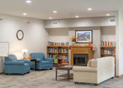 Thumbnail 34 of 35 - a living room with couches and chairs and a fireplace