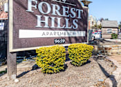 Thumbnail 1 of 28 - A sign for Forest Hills Apartments with the number 9659 on it.