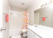 Thumbnail 19 of 19 - a bathroom with a shower toilet and sink and a mirror