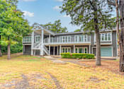 Thumbnail 6 of 19 - a house with a lawn and trees in front of it