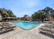 Thumbnail 2 of 17 - our apartments have a resort style pool with chaise lounge chairs