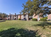 Thumbnail 4 of 17 - our apartments at the district feature a spacious yard and green grass