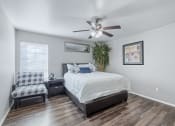 Thumbnail 16 of 17 - a bedroom with a ceiling fan and a bed