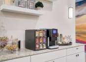 Thumbnail 7 of 14 - a coffee machine on a counter in a kitchen