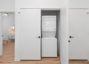 Thumbnail 10 of 23 - a room with a washer and dryer in a closet