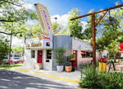 Thumbnail 13 of 14 - a diner with a sign on the side of a building