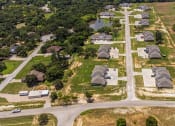 Thumbnail 15 of 21 - an aerial view of a neighborhood of houses and roads