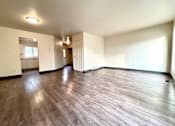 Thumbnail 2 of 14 - an empty living room with a hard wood floor
