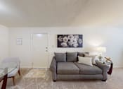 Thumbnail 4 of 11 - a living room with wall to-wall carpeting