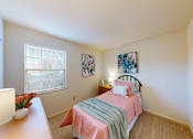 Thumbnail 12 of 15 - a bedroom with a window and walk-in closet