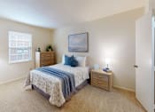 Thumbnail 10 of 15 - a bedroom with a window and walk-in closet