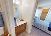 Thumbnail 21 of 21 - A bathroom with a white tub and a blue towel.