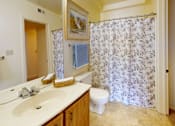 Thumbnail 15 of 21 - a full bathroom with a walk-in closet