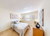 Thumbnail 14 of 19 - a bedroom with a window and walk-in closet
