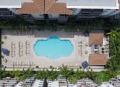 Thumbnail 6 of 24 - an overhead view of a pool at an hotel with palm trees