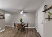 Thumbnail 38 of 65 - A dining room with a table and chairs in a 1 bedroom, 1 bath 560 square foot apartment at Aspen Village Apartments in the Westwood neighborhood of Cincinnati, OH.