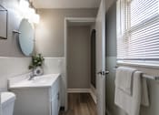 Thumbnail 45 of 65 - A bathroom with a white sink and a white toilet in a 1 bedroom, 1 bath 560 square foot apartment at Aspen Village Apartments in the Westwood neighborhood of Cincinnati, OH.