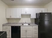 Thumbnail 5 of 56 - This is a photo of the kitchen in the 543 square foot A-style, 1 bedroom, 1 bath apartment at Blue Grass Manor Apartments in Erlanger, KY.