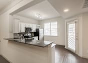 Thumbnail 12 of 52 - kitchen of the 1320 square foot 2 bedroom, 2 and 1/2 bath floor plan  at The Brownstones, Dallas, TX, 75240