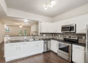 Thumbnail 11 of 52 - kitchen of the 1320 square foot 2 bedroom, 2 and 1/2 bath floor plan  at The Brownstones, Dallas, Texas