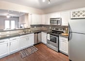 Thumbnail 3 of 52 - Fully Furnished Kitchen at The Brownstones, Dallas, TX