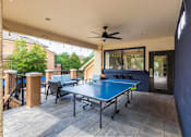 Thumbnail 41 of 52 - A blue table with a JOOO table tennis paddle on it.