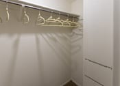 Thumbnail 37 of 62 - hallway walk-in closet with built-in shelving  at The Biltmore, Dallas, TX, 75231